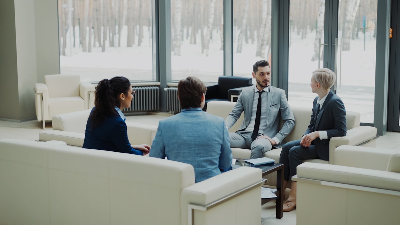 The Growgence team discussing AI visibility strategy in a modern office